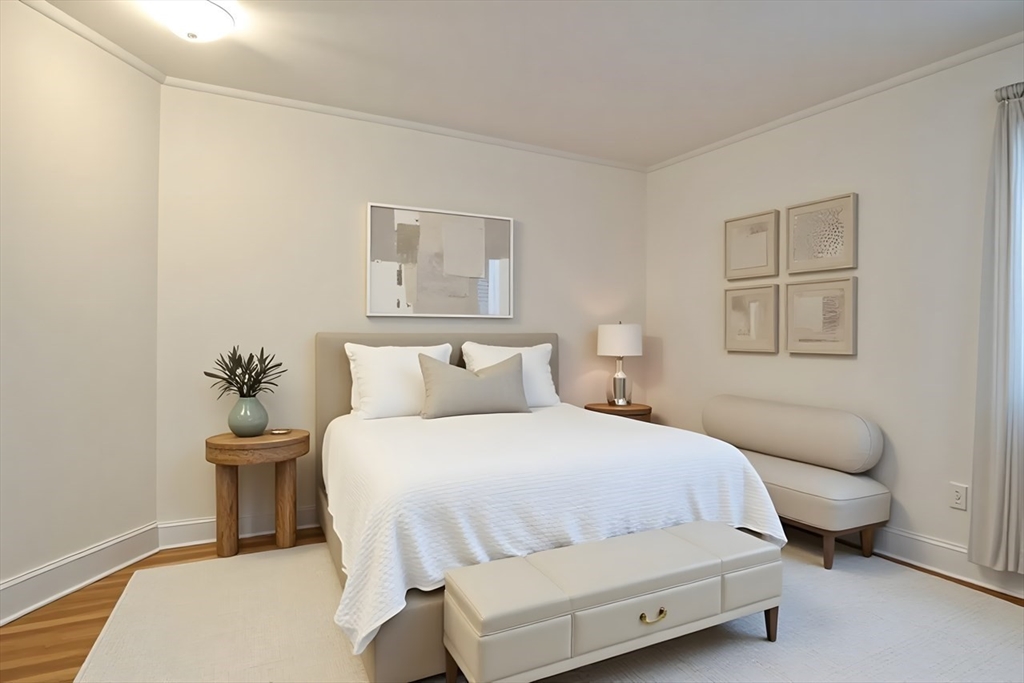 983 Memorial Drive, Unit 502 Cambridge, MA 02138 - Photo 22 of 33 a bedroom with a bed and a lamp