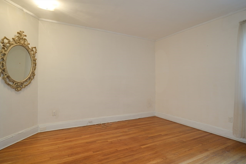 983 Memorial Drive, Unit 502 Cambridge, MA 02138 - Photo 23 of 33 a view of a room with wooden floor and white walls