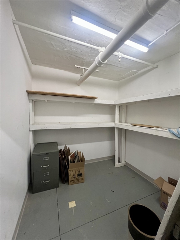 983 Memorial Drive, Unit 502 Cambridge, MA 02138 - Photo 29 of 33 a view of walk in closet with clothes and shoes