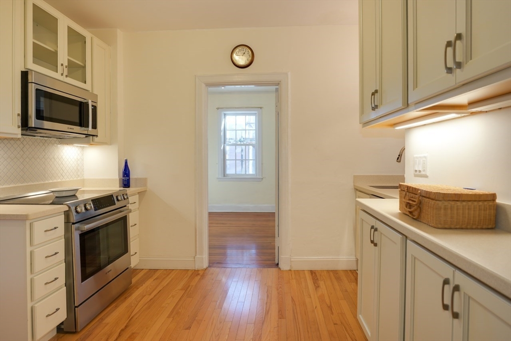 983 Memorial Drive, Unit 502 Cambridge, MA 02138 - Photo 10 of 33 a kitchen with a stove oven and sink