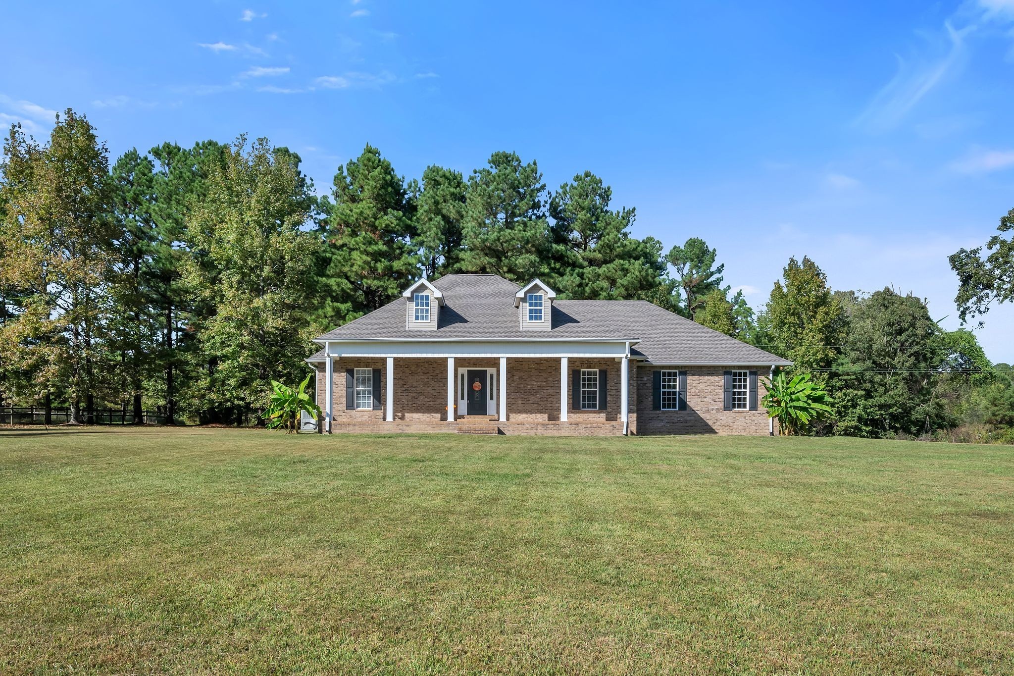 2044 Old Blacktop Road McEwen, TN 37101 - Photo 1 of 45 a house with trees in the background