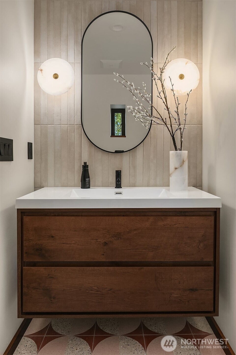 5010 Northeast 52nd Street Seattle, WA 98105 - Photo 12 of 40 a bathroom with a sink and a mirror