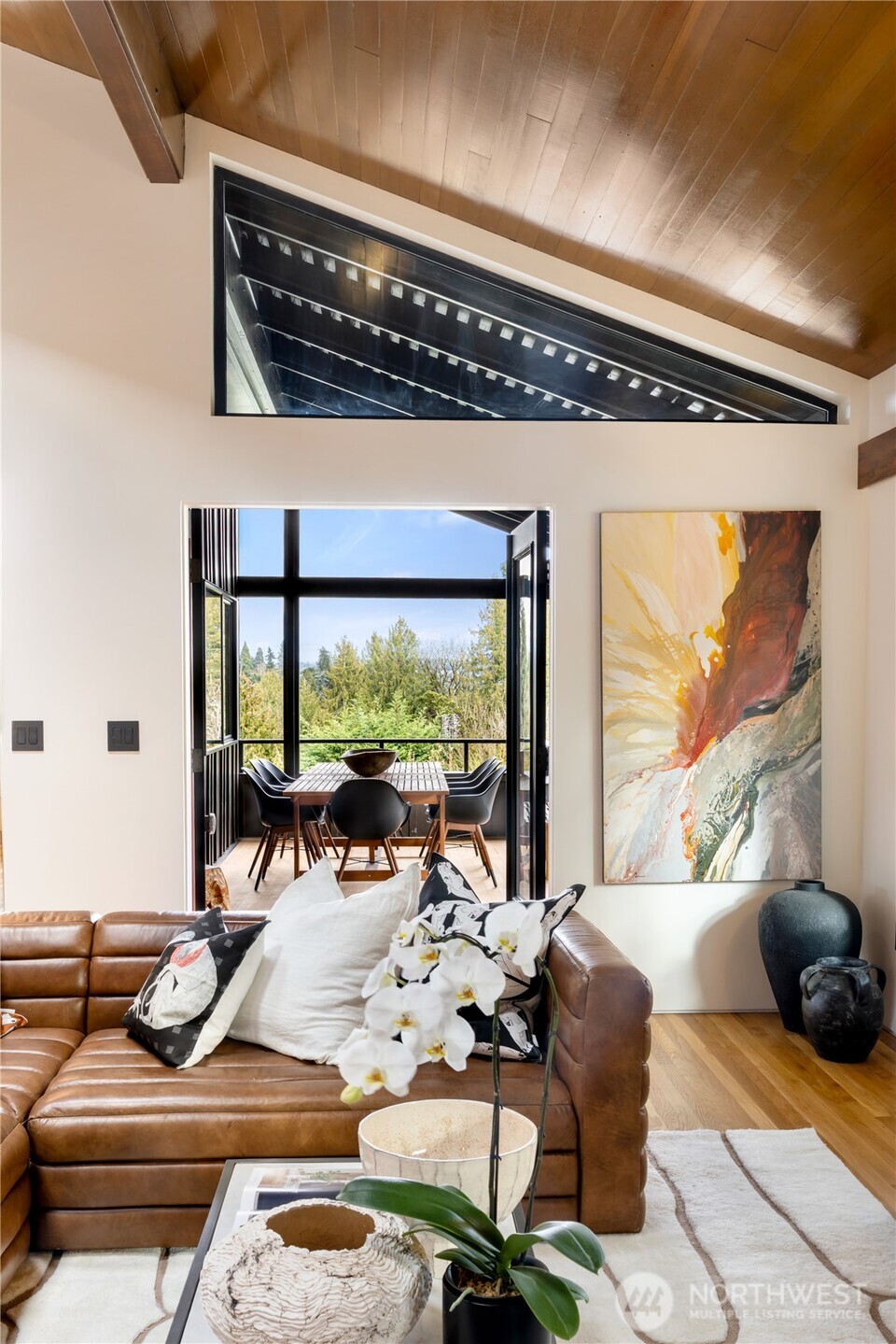 5010 Northeast 52nd Street Seattle, WA 98105 - Photo 17 of 40 a living room with furniture and a floor to ceiling window