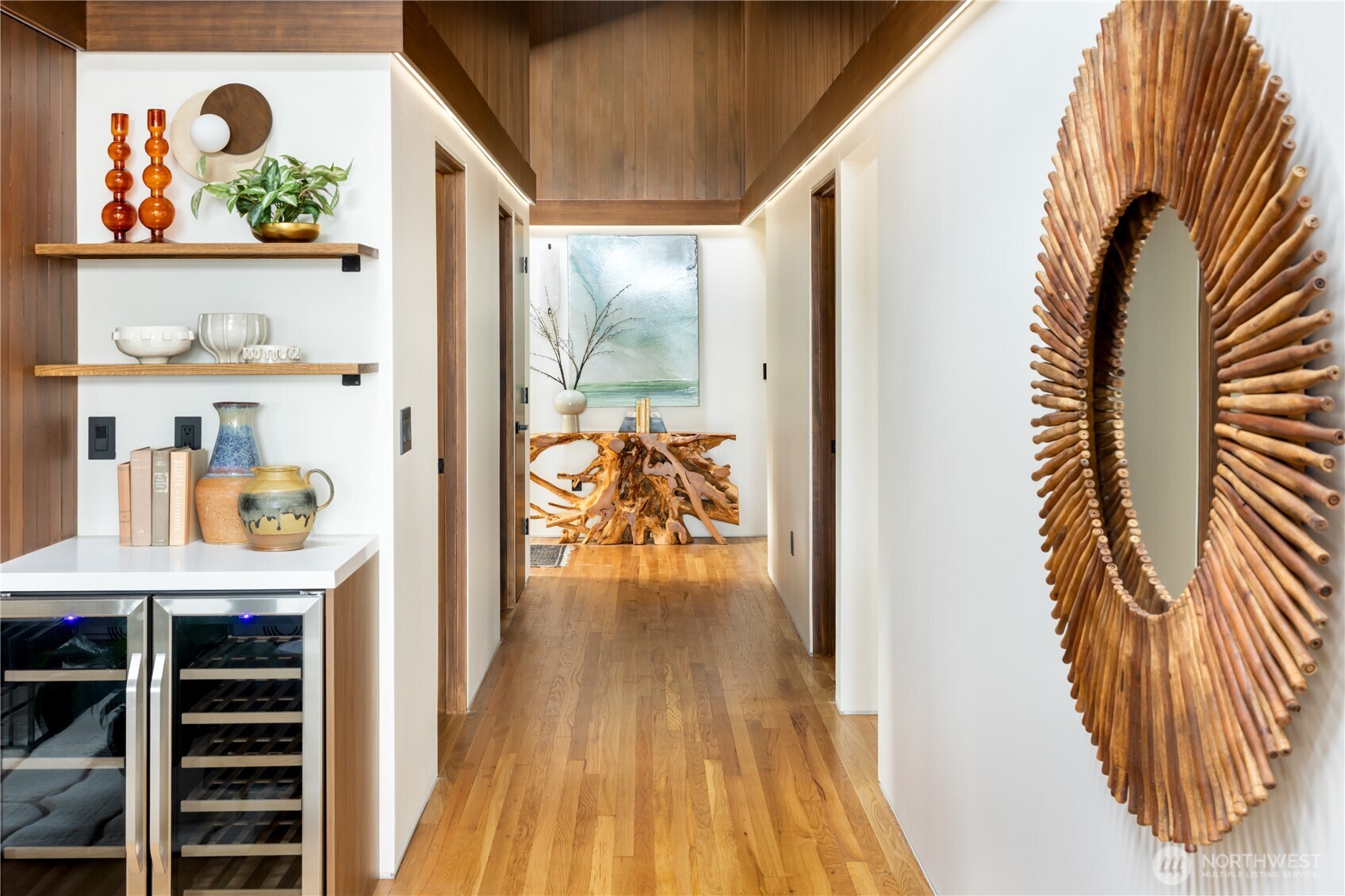 5010 Northeast 52nd Street Seattle, WA 98105 - Photo 18 of 40 a view of a hallway with wooden floor and a dining table