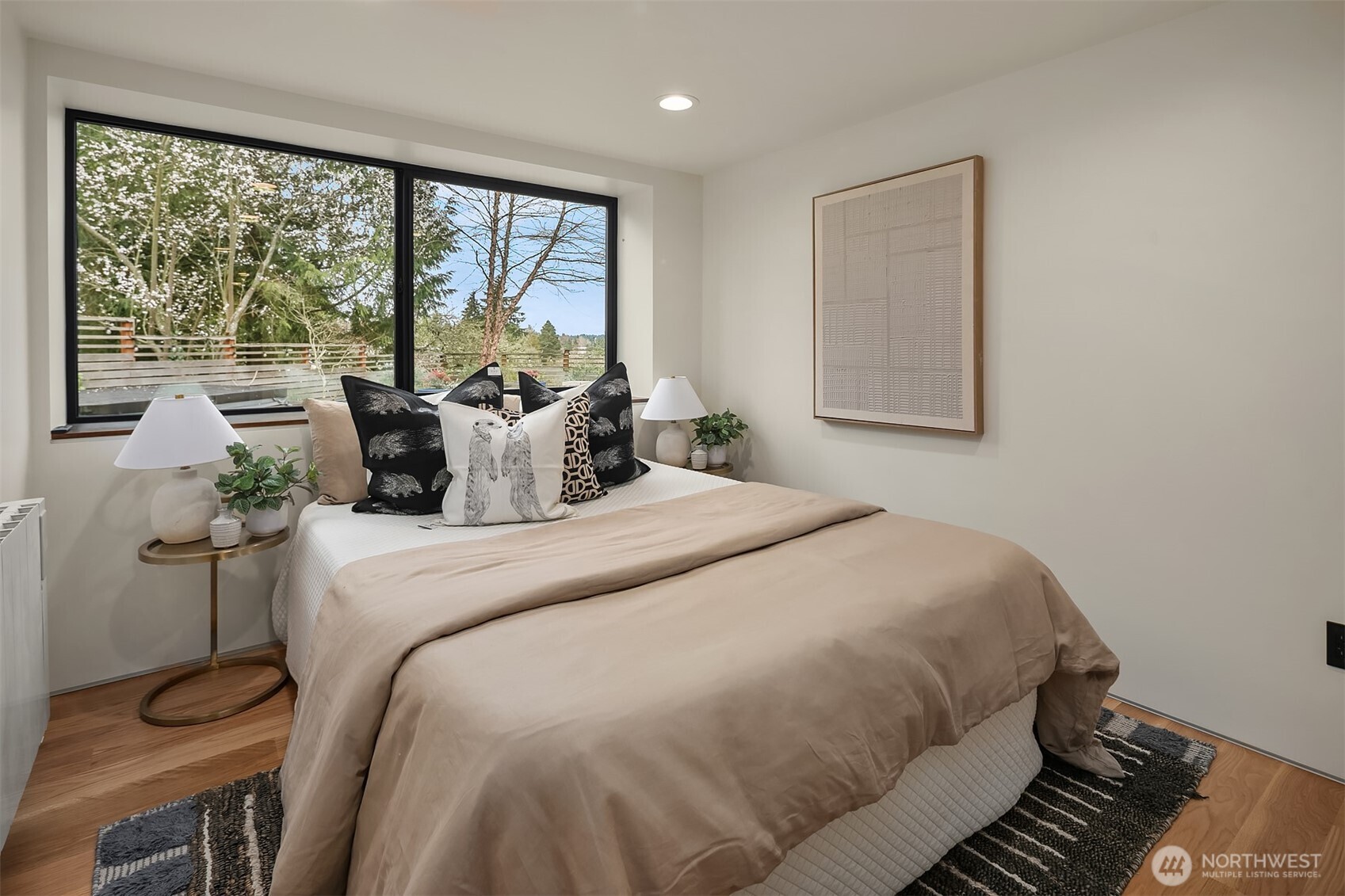 5010 Northeast 52nd Street Seattle, WA 98105 - Photo 32 of 40 a bedroom with a large bed and a large window