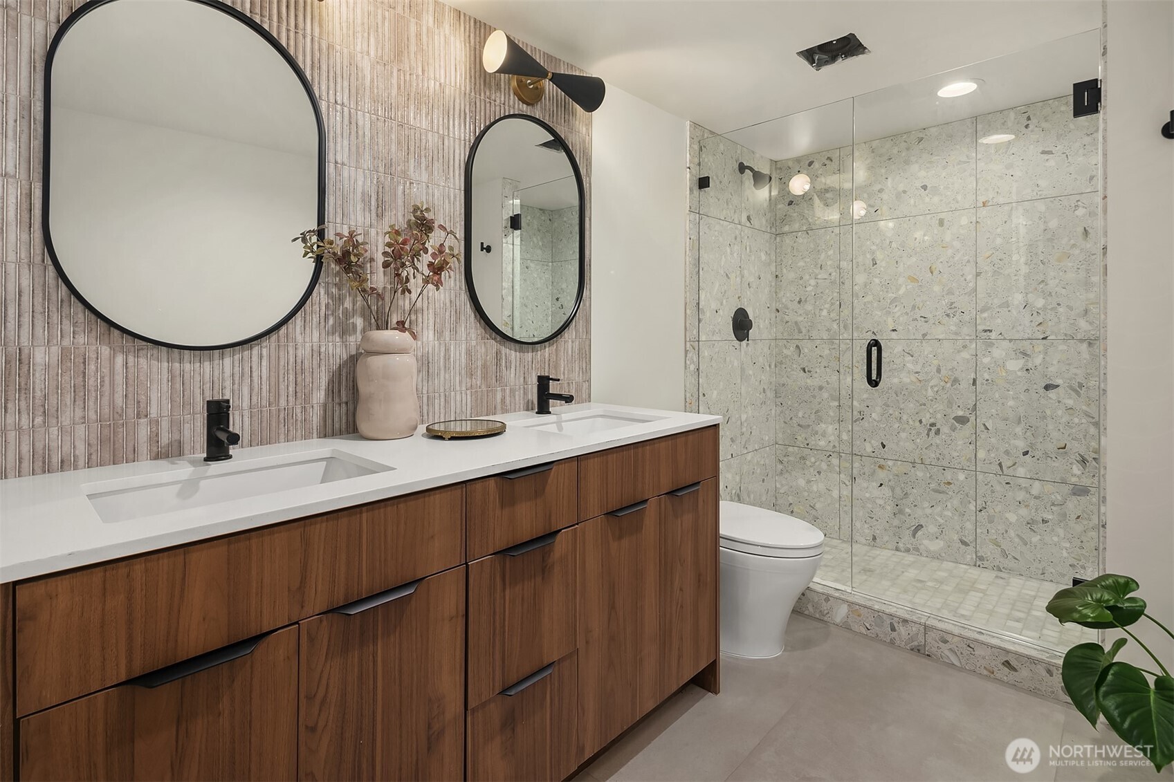 5010 Northeast 52nd Street Seattle, WA 98105 - Photo 33 of 40 a bathroom with a double vanity sink mirror and toilet