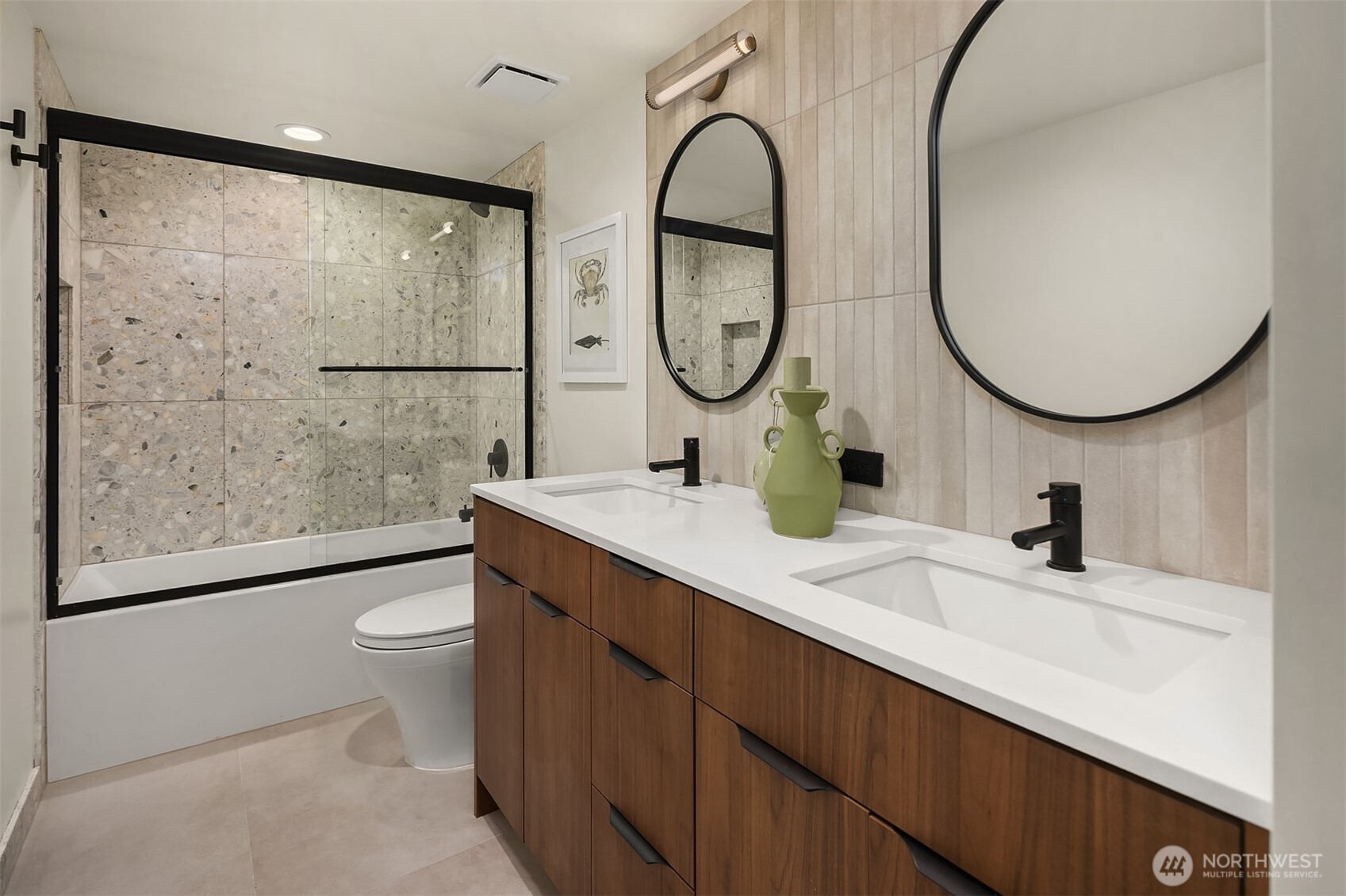 5010 Northeast 52nd Street Seattle, WA 98105 - Photo 35 of 40 a bathroom with a toilet a sink and a mirror