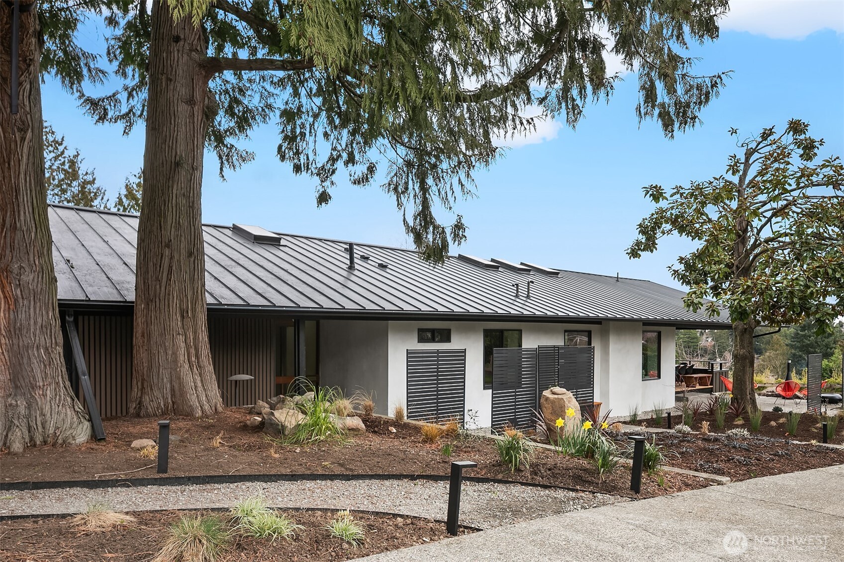 5010 Northeast 52nd Street Seattle, WA 98105 - Photo 39 of 40 a front view of a house with garden and porch