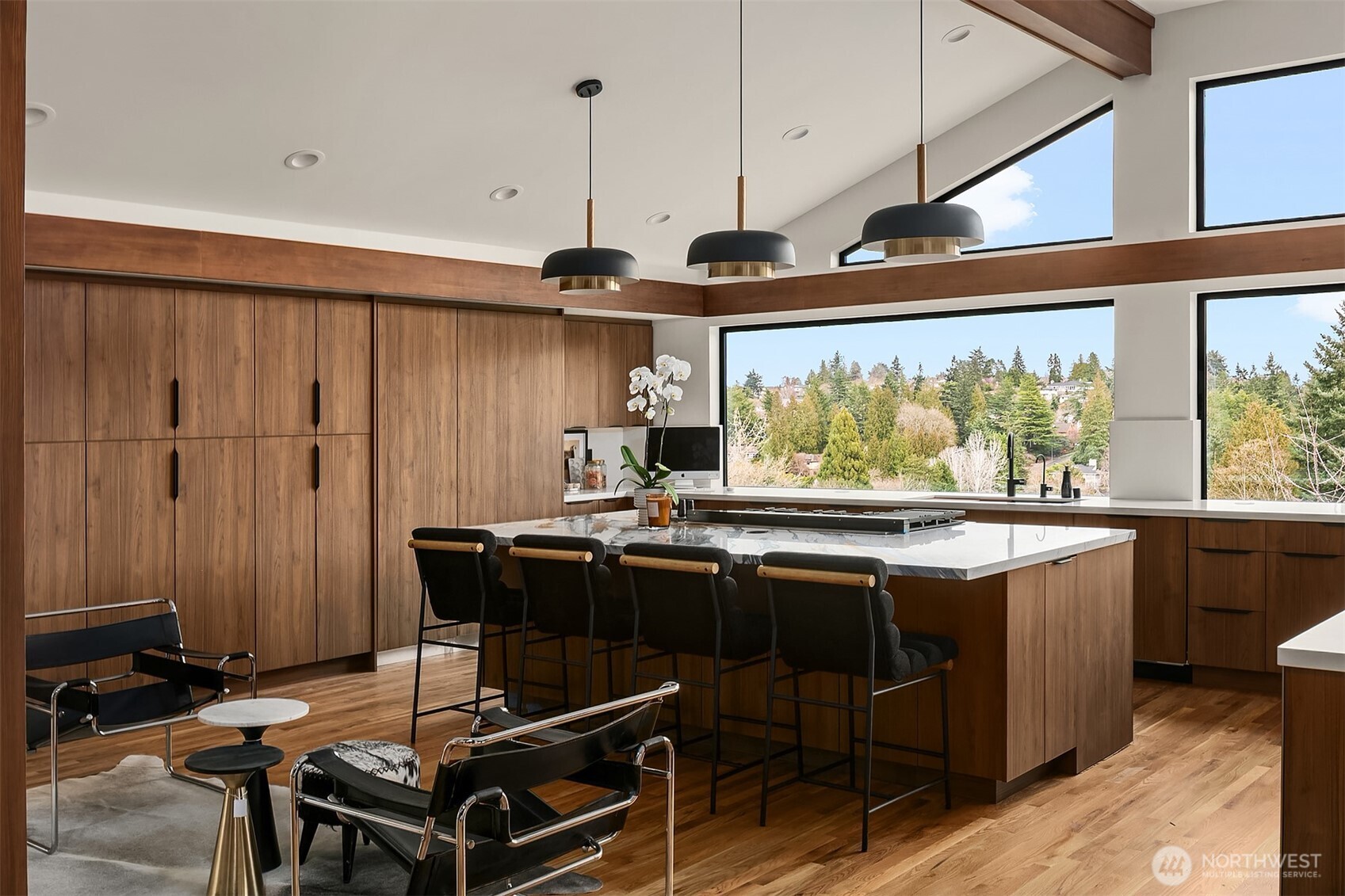 5010 Northeast 52nd Street Seattle, WA 98105 - Photo 7 of 40 a view of a kitchen with kitchen island stainless steel appliances a sink and a large window