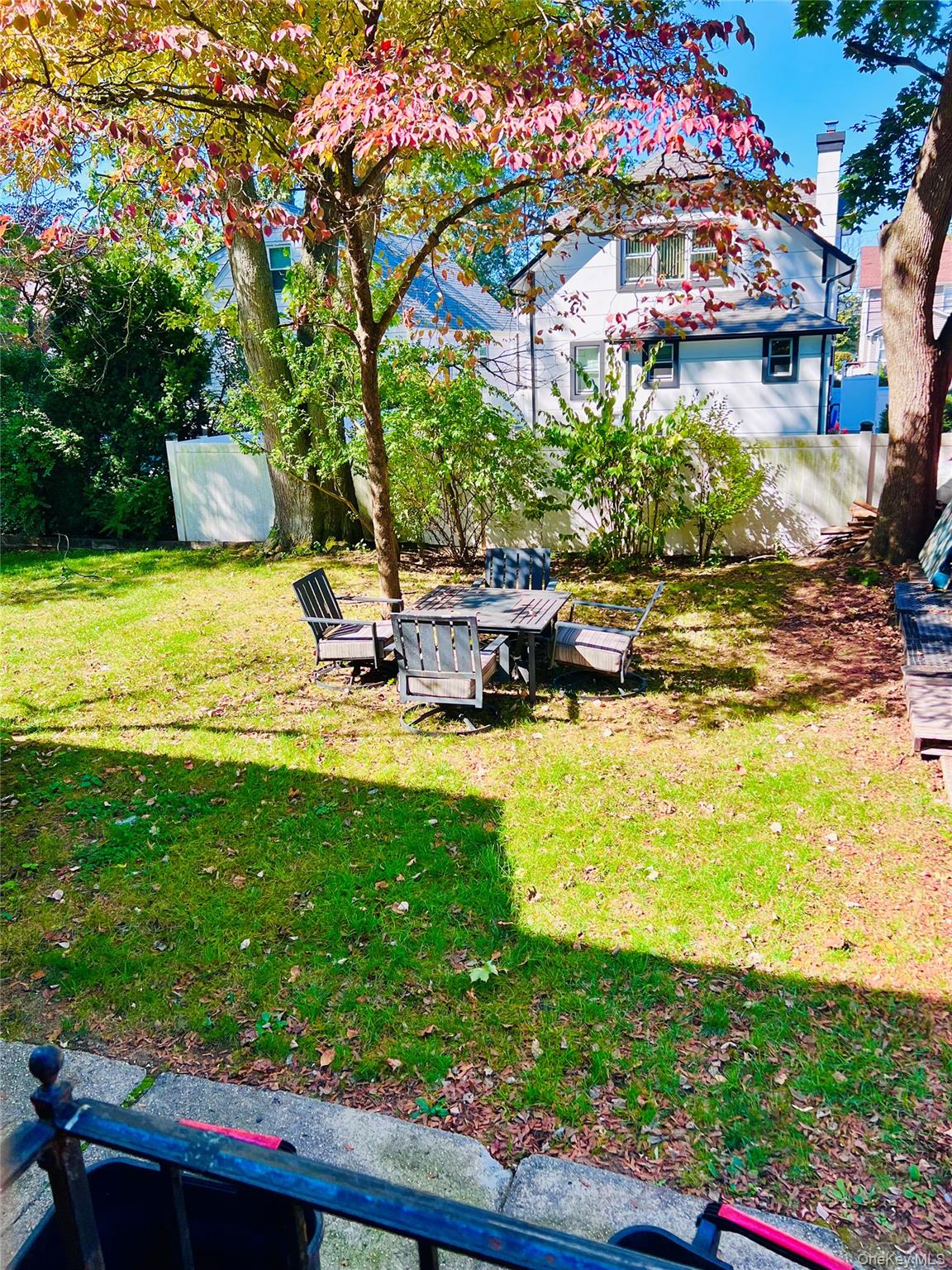 114 Camdike Street Valley Stream, NY 11580 - Photo 11 of 12 a view of a lake with a house in the background