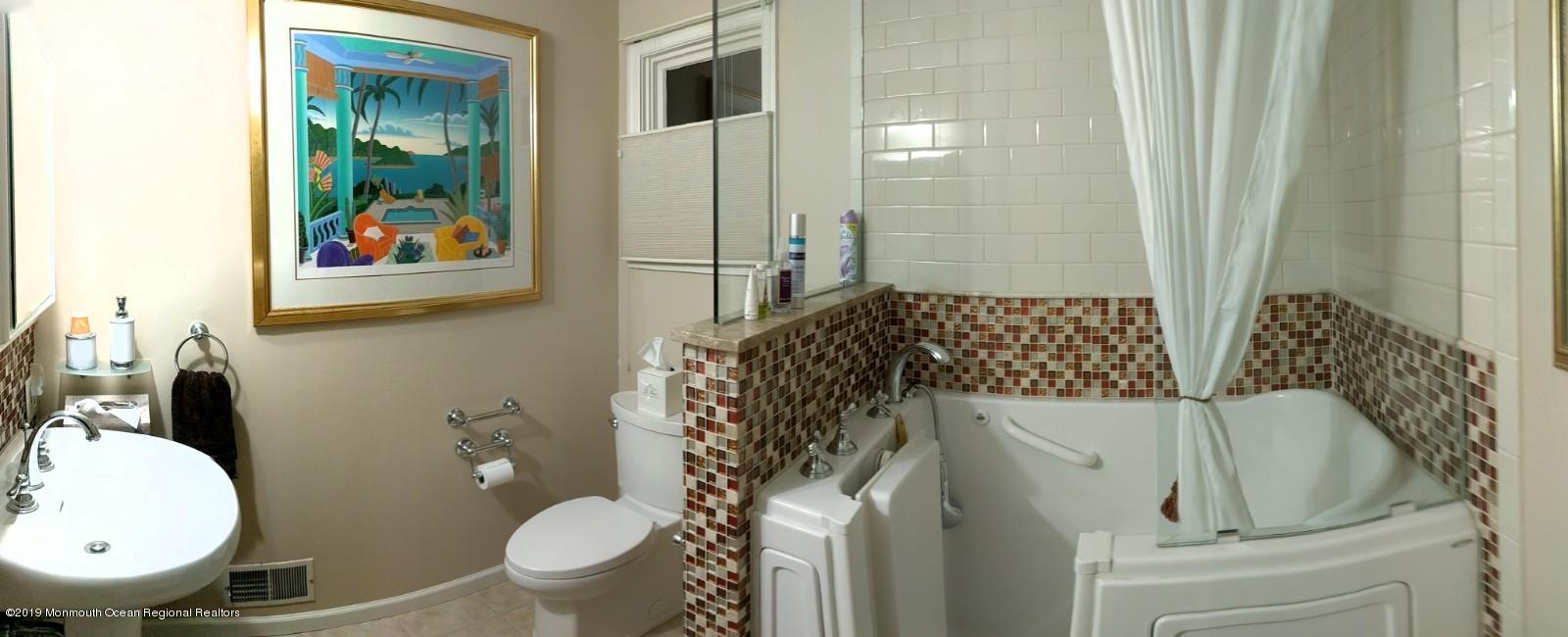 9 Beaver Hill Road Morganville, NJ 07751 - Photo 32 of 50 a bathroom with a toilet and a sink
