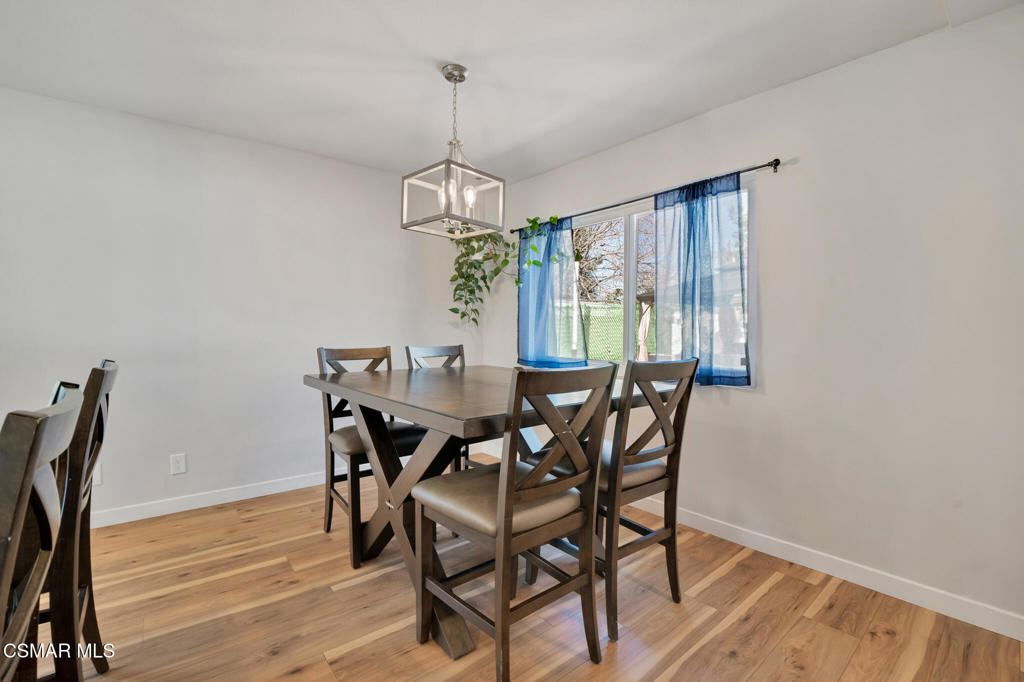 926 Talbert Avenue Simi Valley, CA 93065 - Photo 11 of 41 a view of a dining room with furniture window and wooden floor