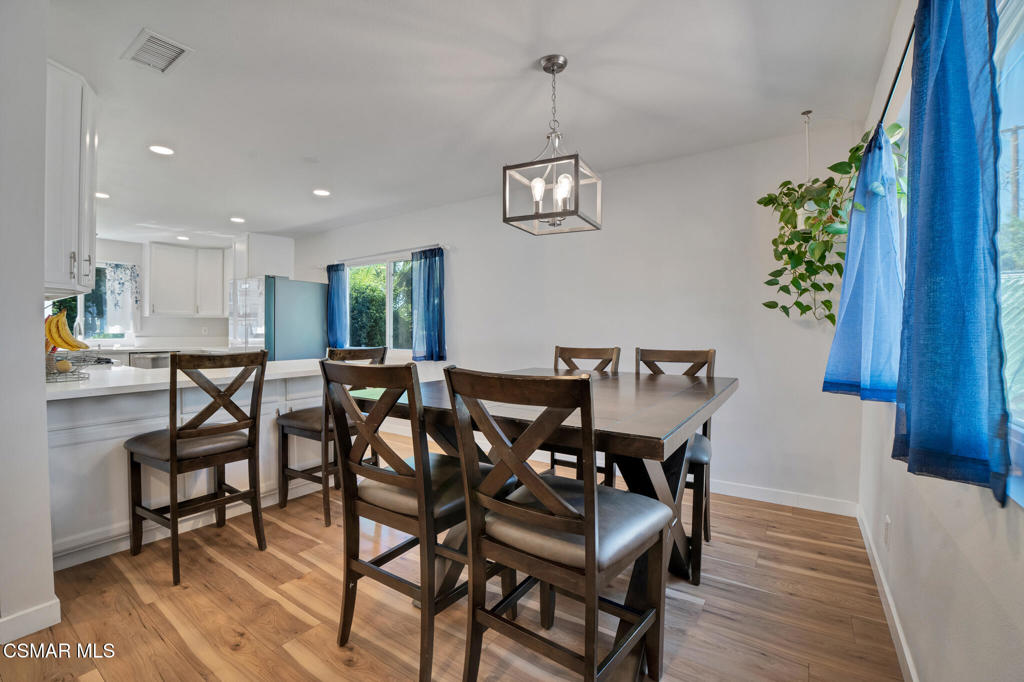 926 Talbert Avenue Simi Valley, CA 93065 - Photo 12 of 41 a view of a dining room with furniture wooden floor and chandelier