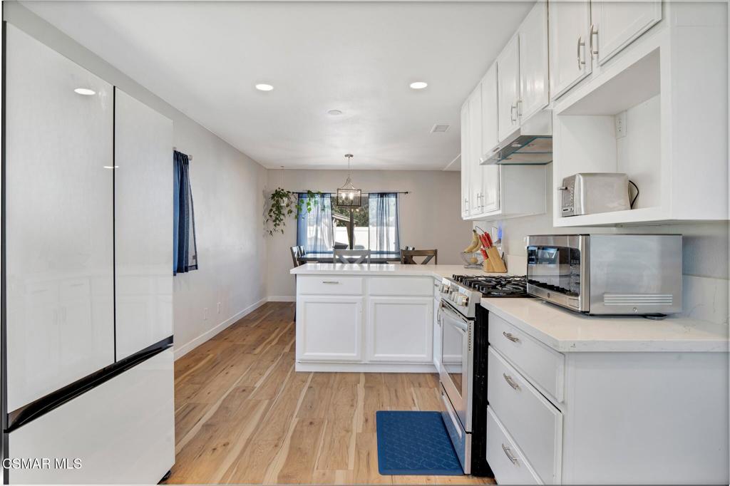 926 Talbert Avenue Simi Valley, CA 93065 - Photo 14 of 41 a kitchen with a sink stove and cabinets