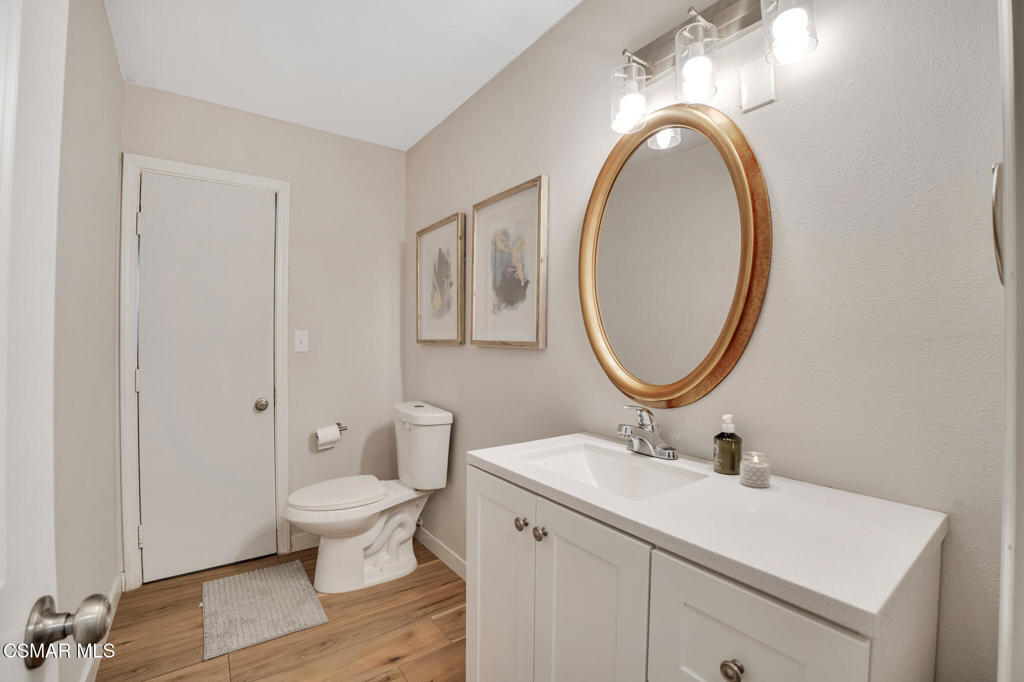 926 Talbert Avenue Simi Valley, CA 93065 - Photo 18 of 41 a bathroom with a toilet a sink and a mirror