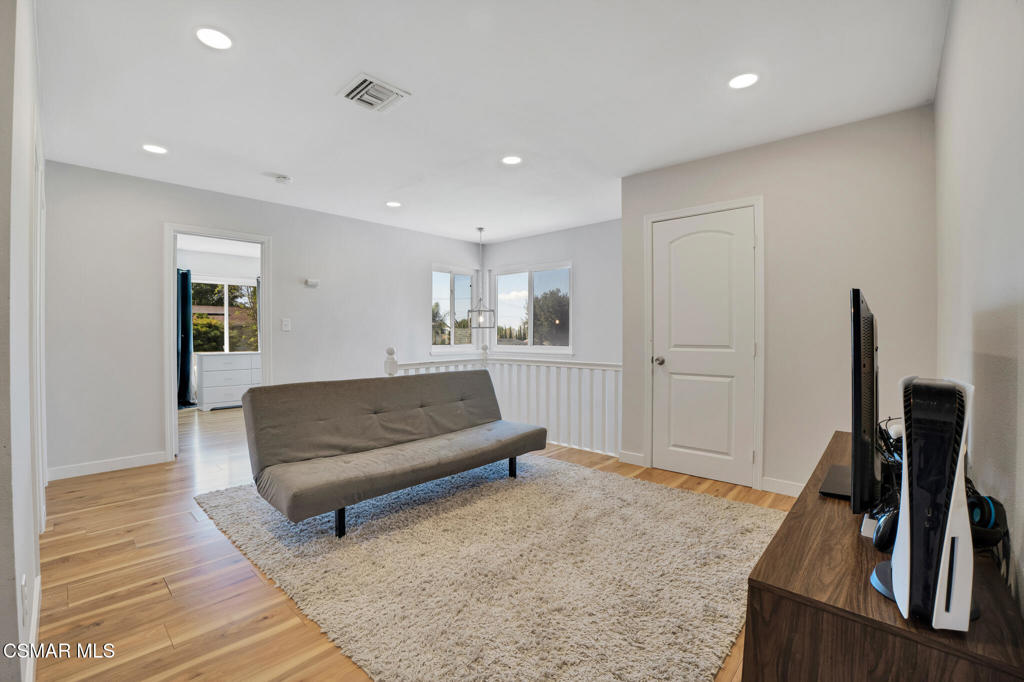 926 Talbert Avenue Simi Valley, CA 93065 - Photo 20 of 41 a living room with furniture and a flat screen tv
