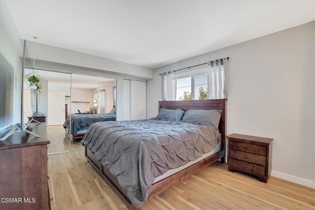 926 Talbert Avenue Simi Valley, CA 93065 - Photo 25 of 41 a spacious bedroom with a bed a couch and large windows