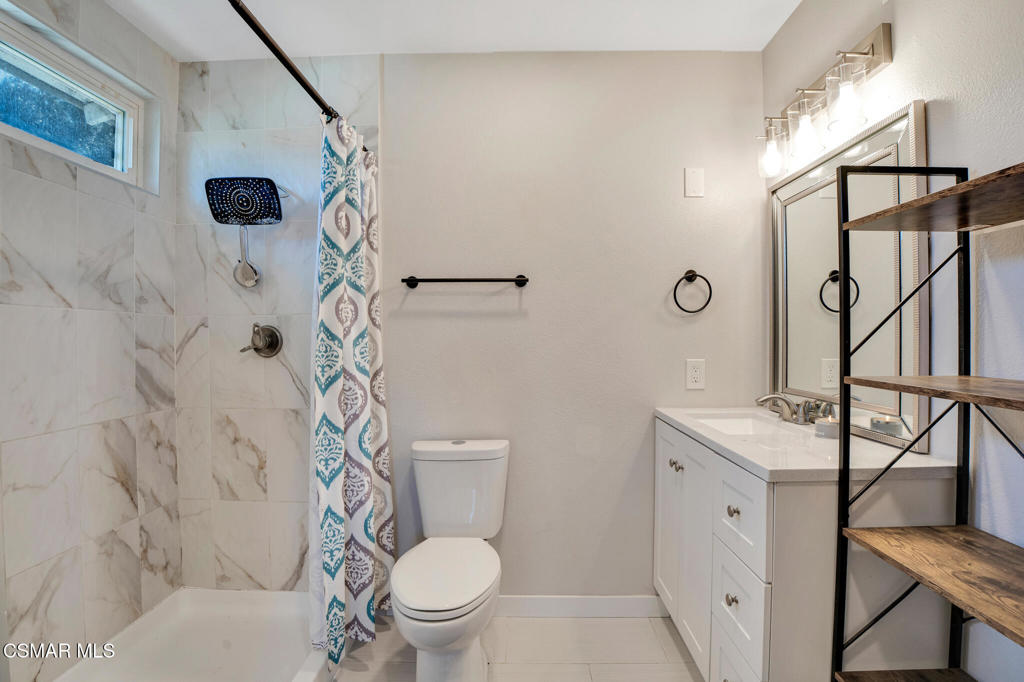 926 Talbert Avenue Simi Valley, CA 93065 - Photo 27 of 41 a white toilet sitting next to a bathroom sink