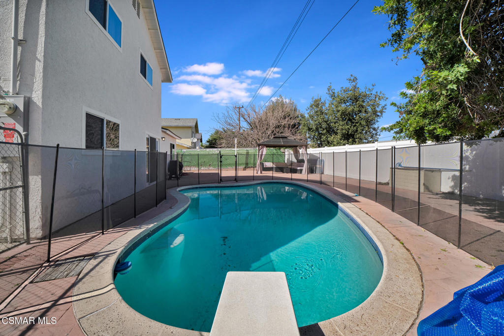 926 Talbert Avenue Simi Valley, CA 93065 - Photo 32 of 41 a view of a swimming pool with a patio