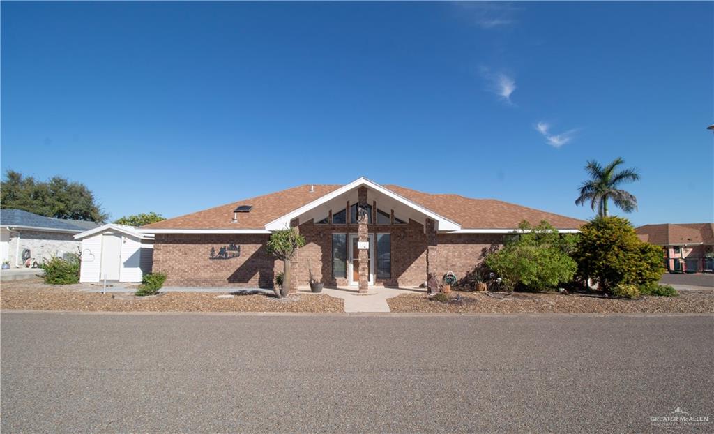 401 Taurus Street Mission, TX 78572 - Photo 1 of 18 a front view of a house with a yard and garage