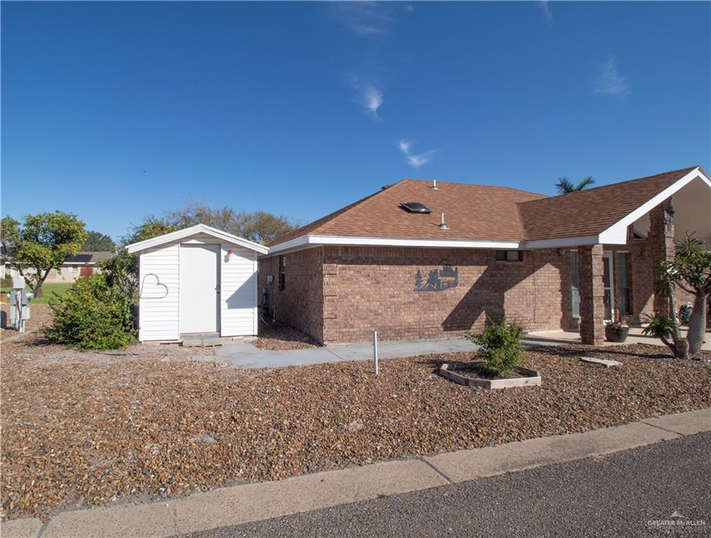 401 Taurus Street Mission, TX 78572 - Photo 18 of 18 a front view of a house with a yard