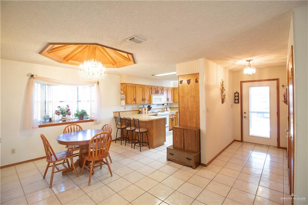 401 Taurus Street Mission, TX 78572 - Photo 5 of 18 a view of a dining room with furniture