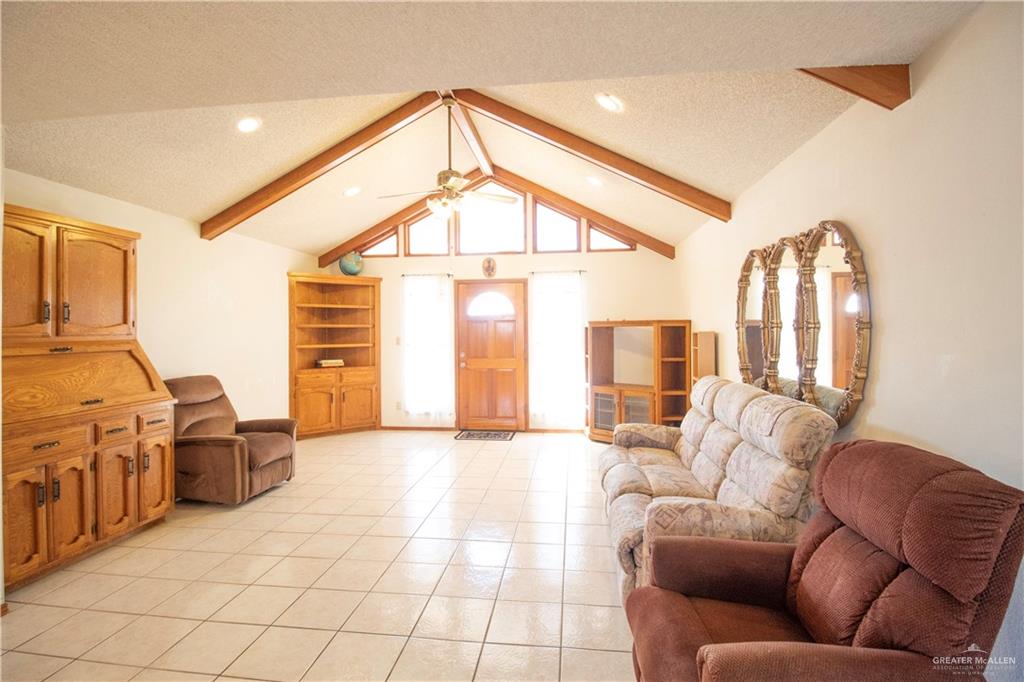 401 Taurus Street Mission, TX 78572 - Photo 9 of 18 a living room with furniture and a large window