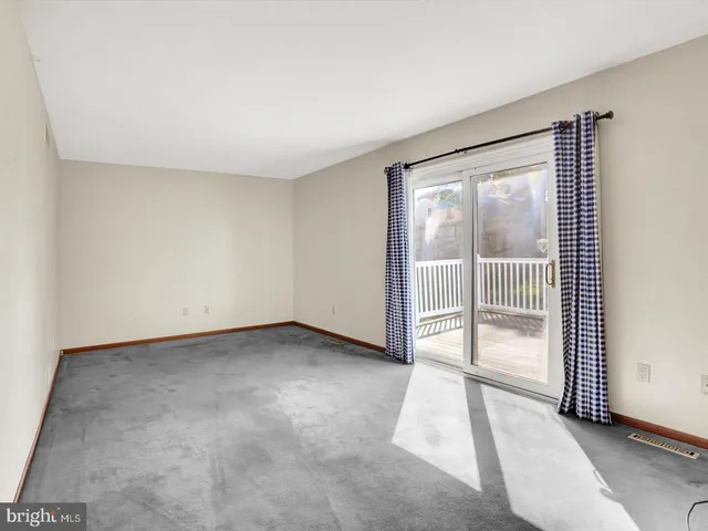 a view of an empty room and window