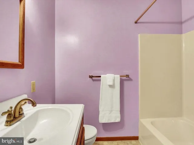 a bathroom with a sink and a bath tub