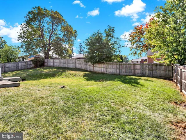 a swimming pool that is sitting in the grass