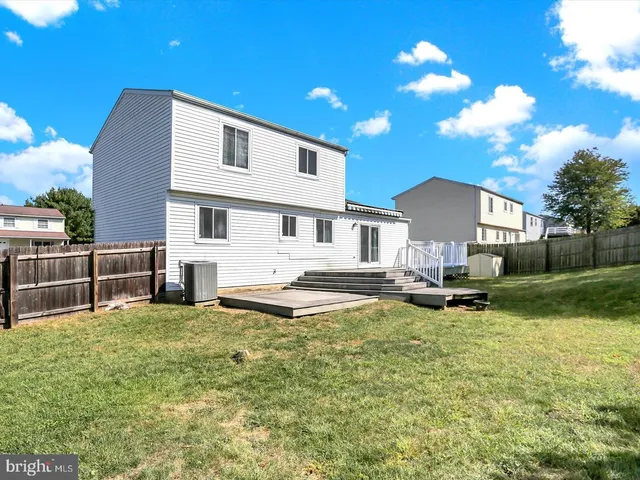 a view of a house with swimming pool and sitting area