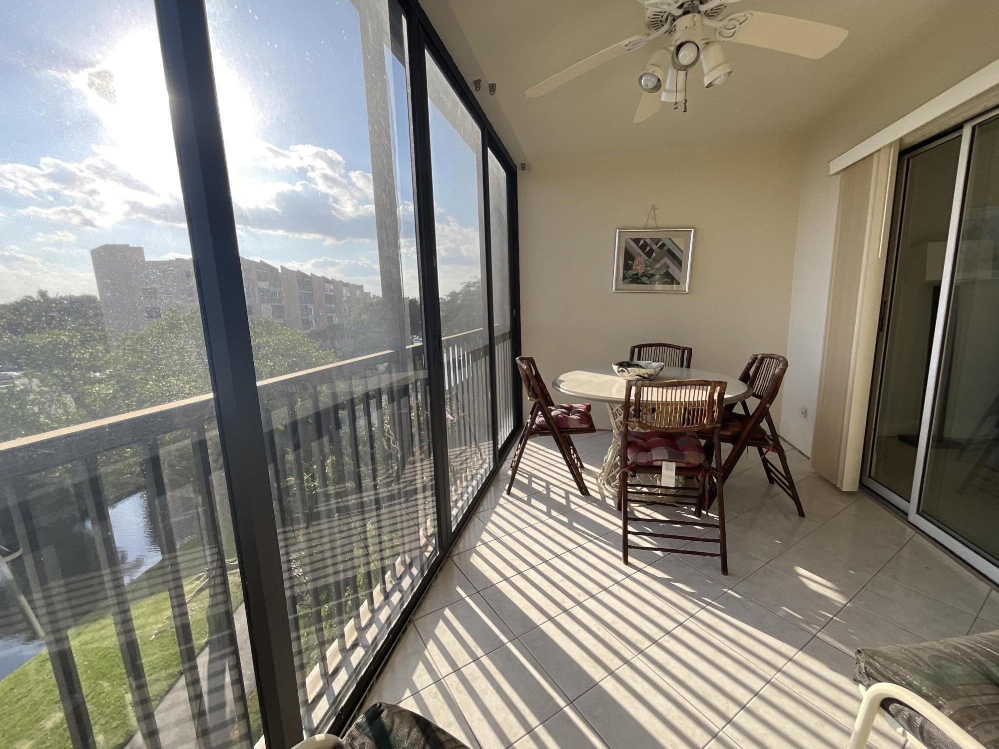 14475 Strathmore Lane, Unit 501 Delray Beach, FL 33446 - Photo 38 of 53 Covered enclosed balcony
