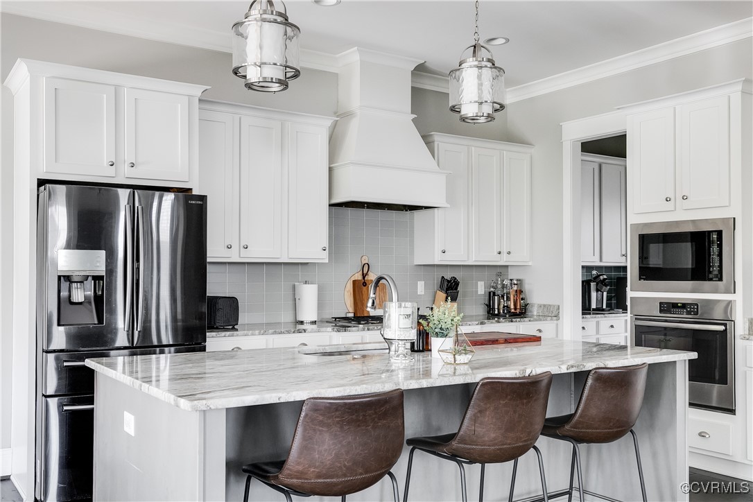 16506 Binley Road Midlothian, VA 23112 - Photo 21 of 49 a kitchen with stainless steel appliances a kitchen island a stove a table and chairs in it