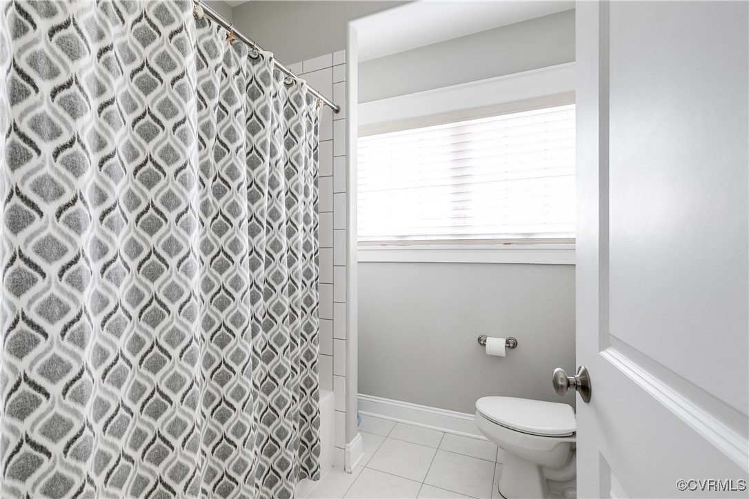16506 Binley Road Midlothian, VA 23112 - Photo 38 of 49 a bathroom with a granite countertop toilet and a shower curtain