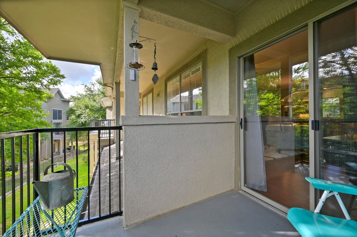 11203 Ranch Road 2222, Unit 1104 Austin, TX 78730 - Photo 14 of 24 a view of a balcony with furniture