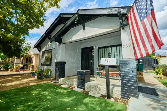 a front view of a house with garden