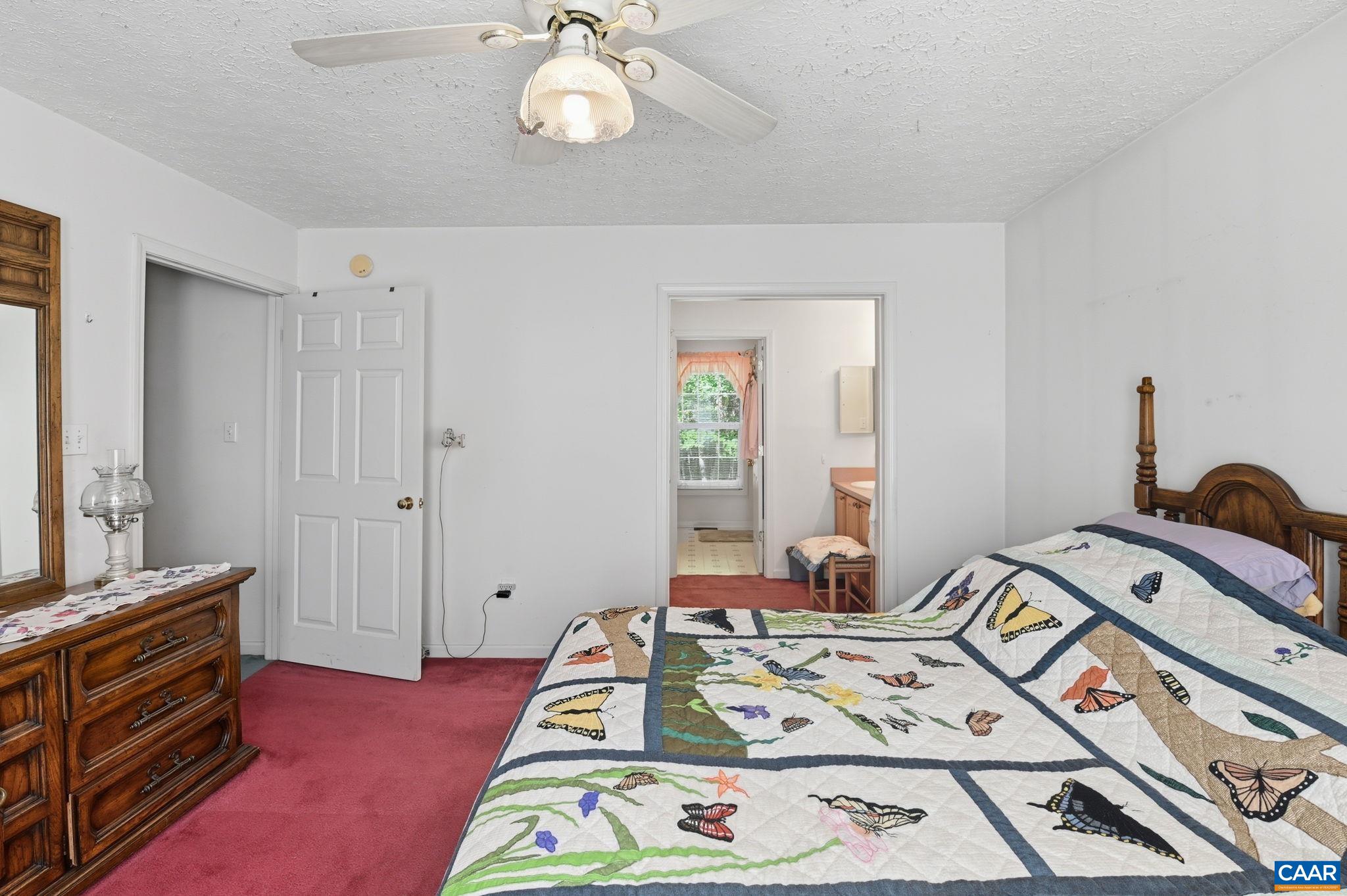 16070 Burnley Road Barboursville, VA 22923 - Photo 13 of 37 a bed room with a bed and a dresser