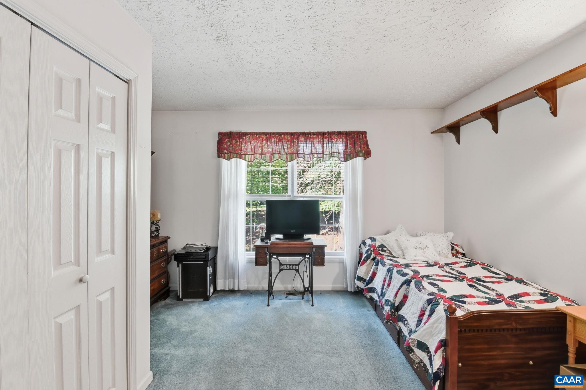 16070 Burnley Road Barboursville, VA 22923 - Photo 19 of 37 a bedroom with a bed and wooden floor