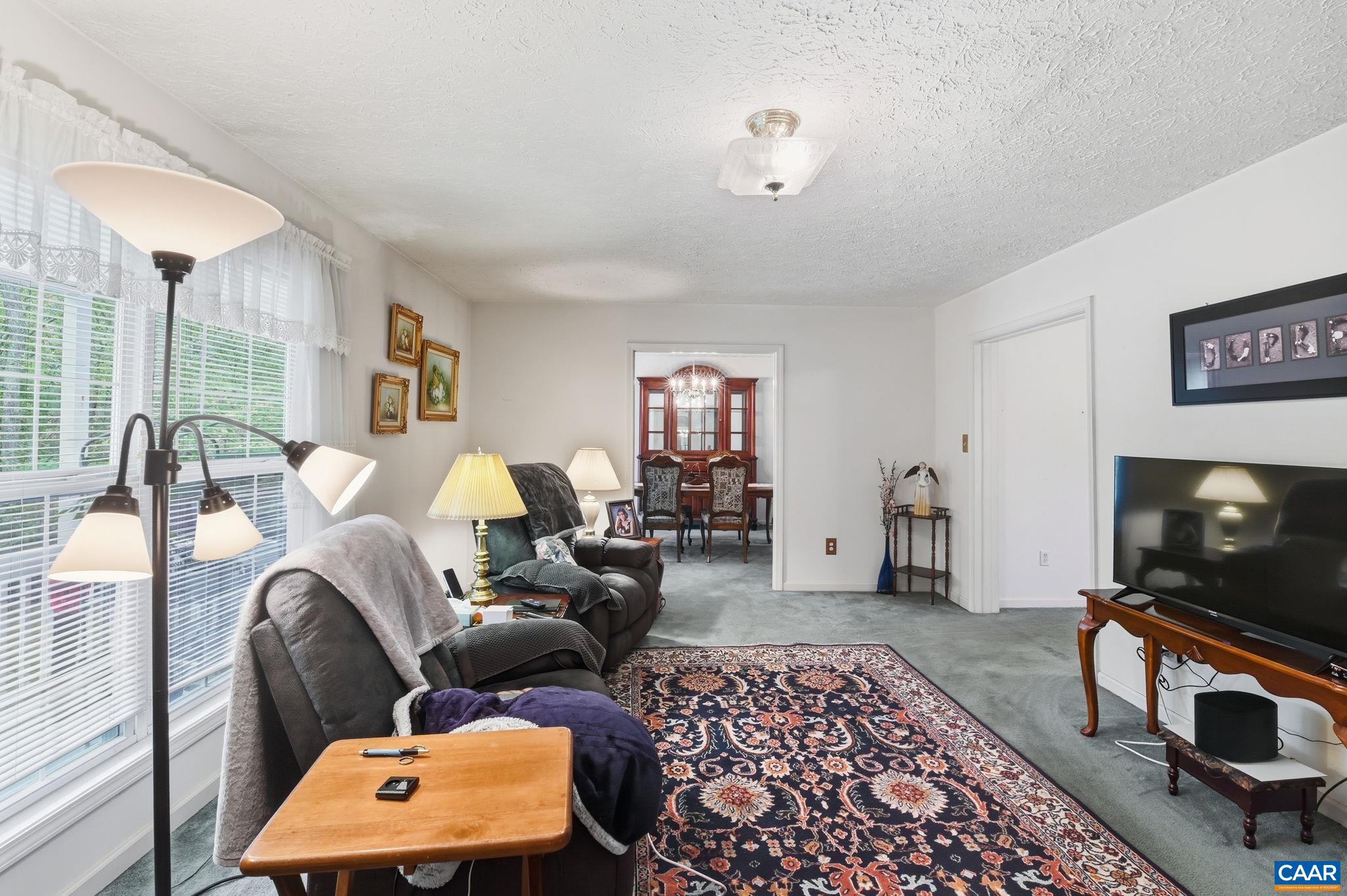 16070 Burnley Road Barboursville, VA 22923 - Photo 4 of 37 a living room with furniture and a flat screen tv
