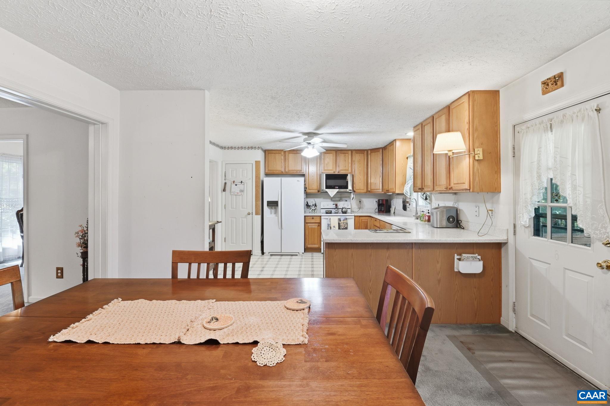 16070 Burnley Road Barboursville, VA 22923 - Photo 10 of 37 a kitchen with stainless steel appliances granite countertop a sink dishwasher and a refrigerator