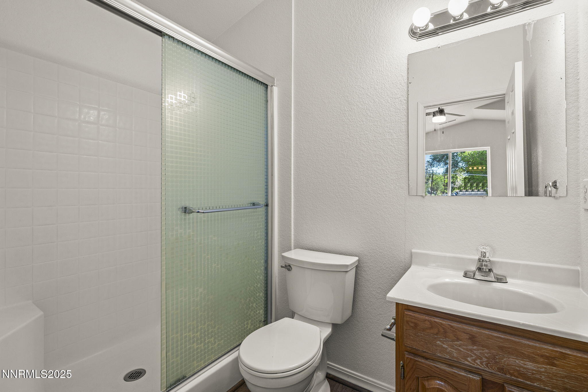 515 College Drive Reno, NV 89503 - Photo 14 of 25 a bathroom with a sink a toilet and shower