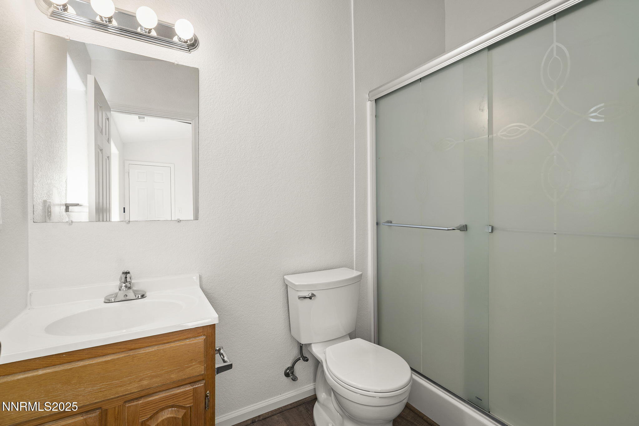 515 College Drive Reno, NV 89503 - Photo 18 of 25 a bathroom with a sink a toilet and shower