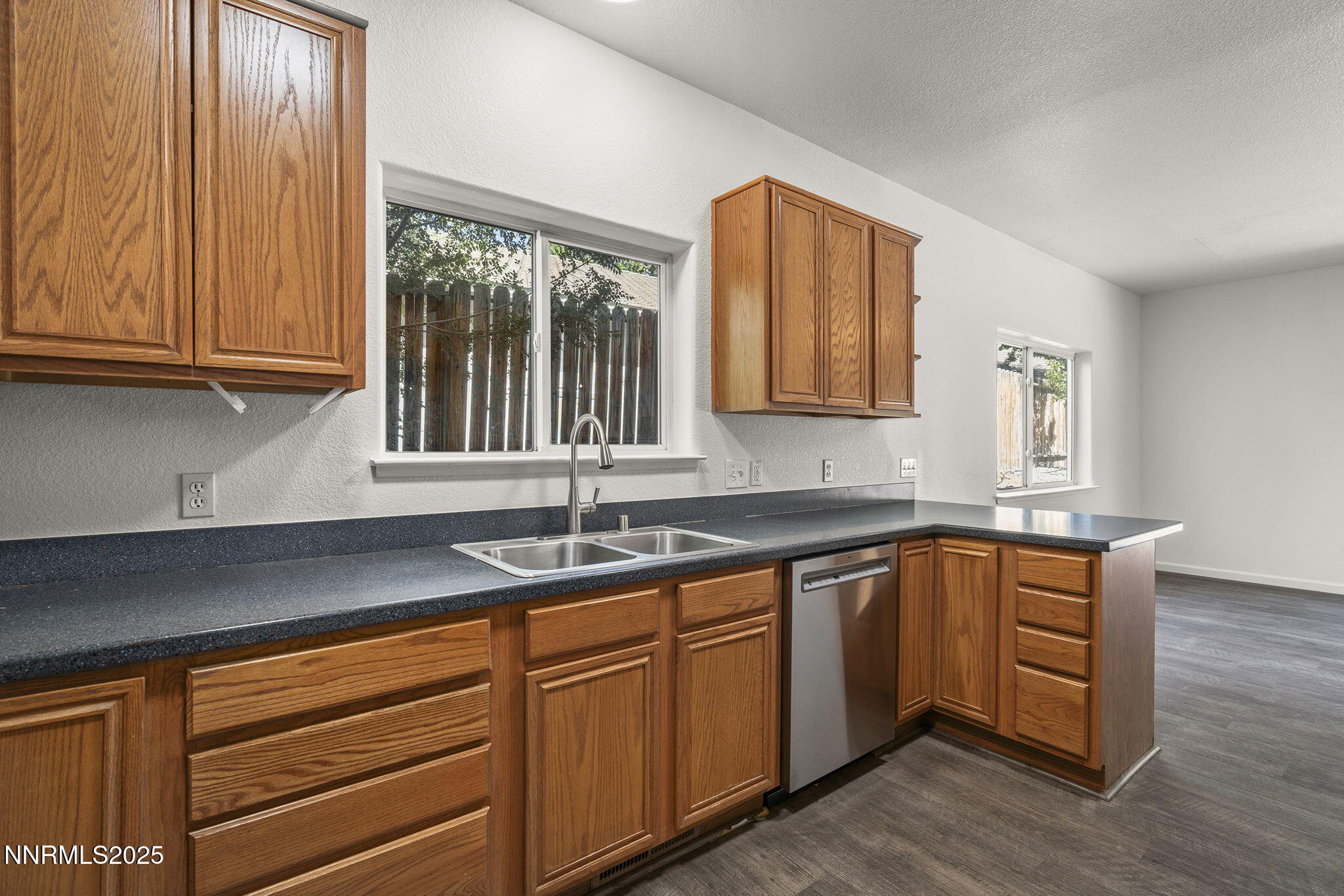 515 College Drive Reno, NV 89503 - Photo 10 of 25 a kitchen with granite countertop a sink and a window