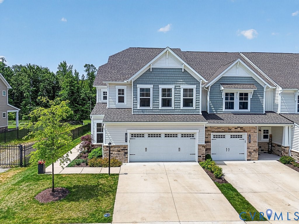 18517 Palisades Ridge Moseley, VA 23120 - Photo 39 of 55 a front view of a house with a yard and garage