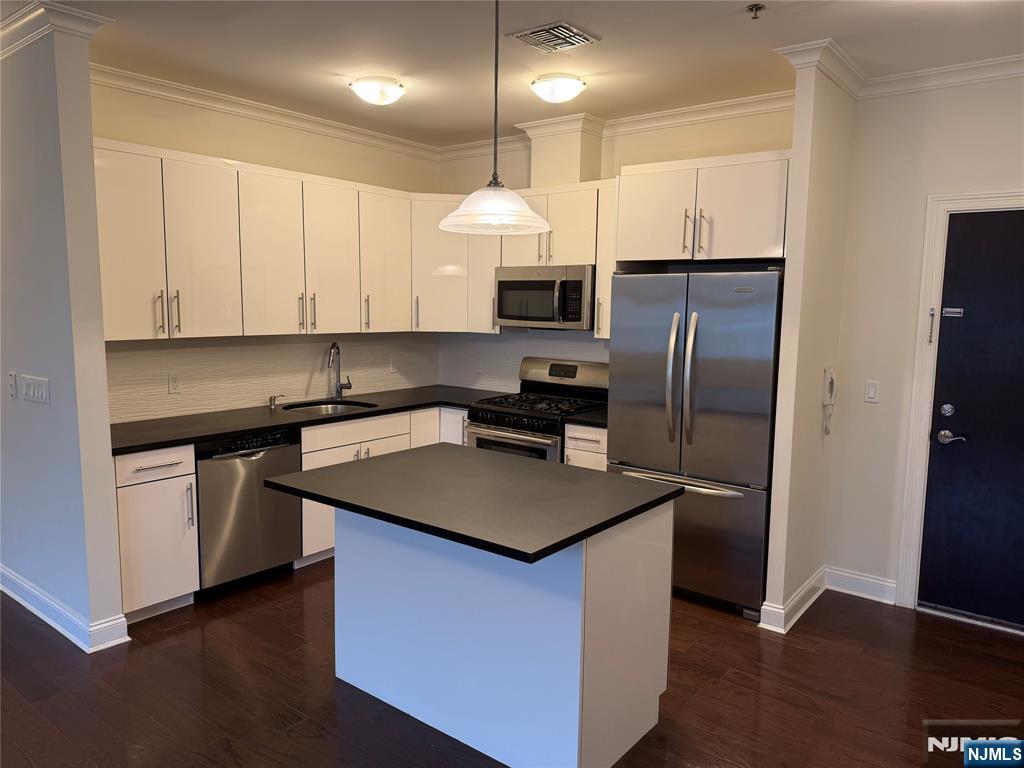 2001 Hudson Terrace, Unit 404 Fort Lee, NJ 07024 - Photo 3 of 21 a kitchen with stainless steel appliances granite countertop a refrigerator a sink dishwasher a stove and white cabinets