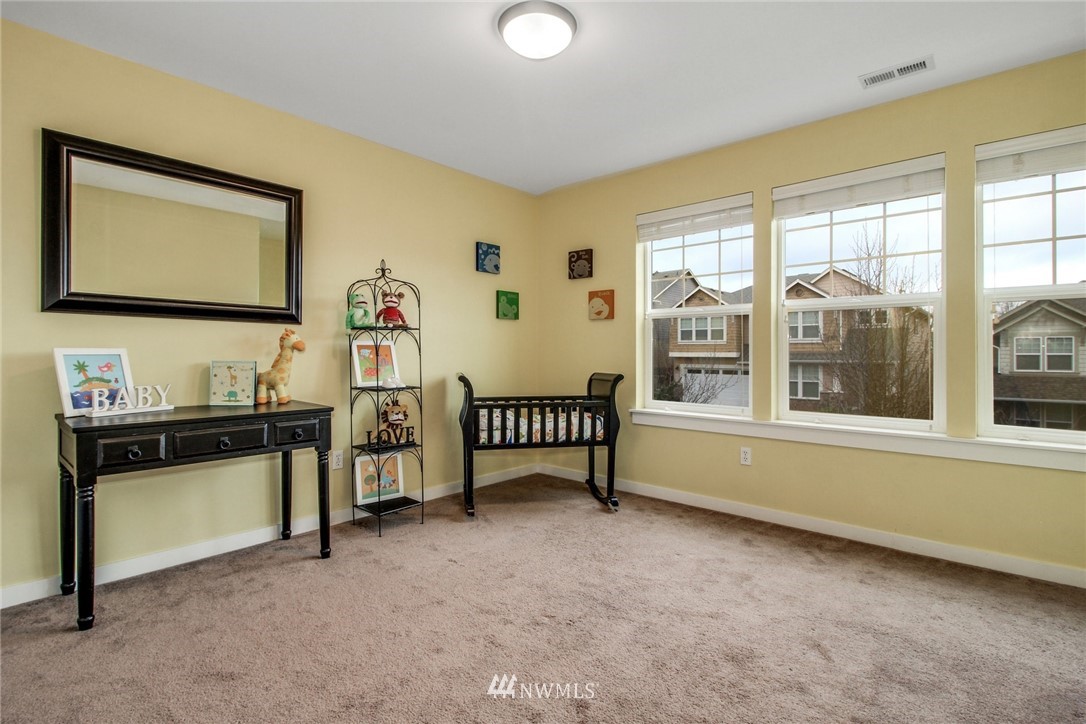 5211 Northeast 7th Court Renton, WA 98059 - Photo 22 of 23 a living room with furniture and a flat screen tv
