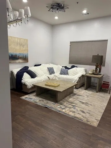 a bed room with furniture and window