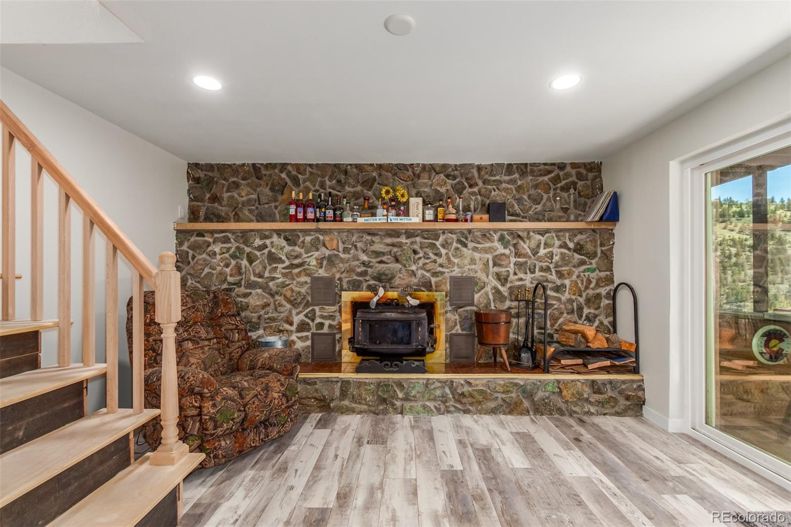 11388 Ranch Elsie Road Golden, CO 80403 - Photo 17 of 50 a view of a fireplace in a room