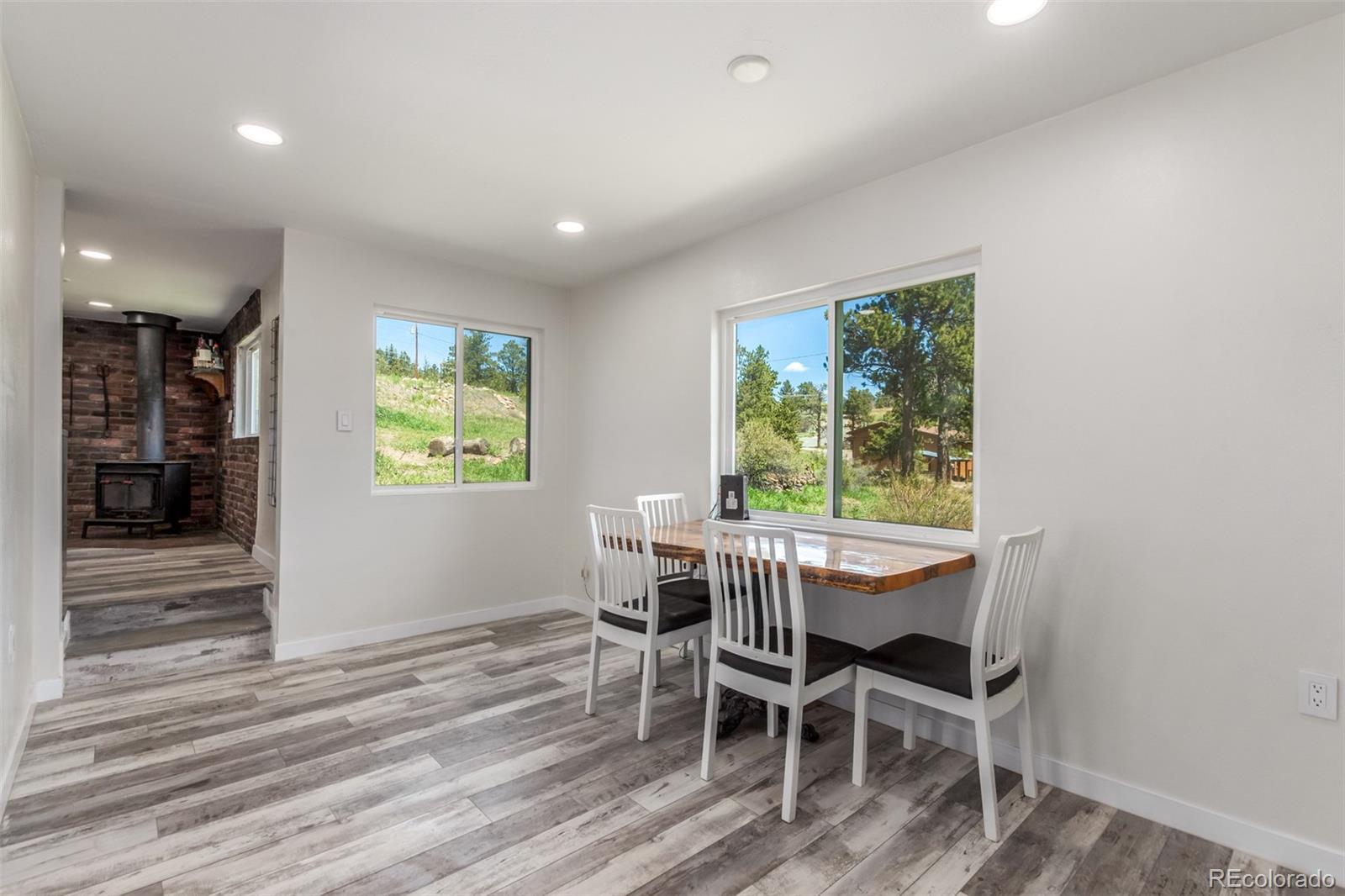 11388 Ranch Elsie Road Golden, CO 80403 - Photo 19 of 50 a dining room with furniture and window
