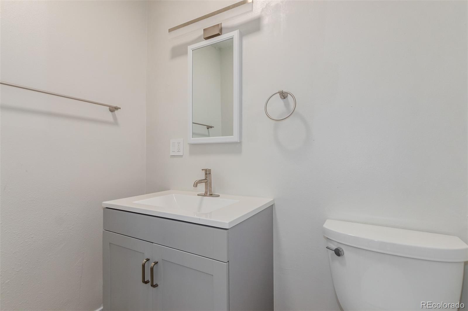 11388 Ranch Elsie Road Golden, CO 80403 - Photo 35 of 50 a bathroom with a sink a toilet and vanity
